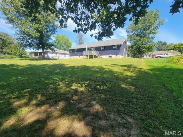 301 S Sloan St, Lebanon, MO 65536 - view of yard featuring a deck and stairs