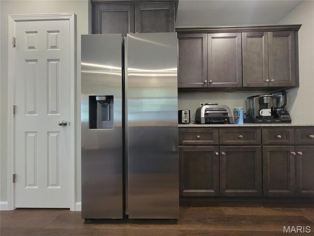 301 S Sloan St, Lebanon, MO 65536 - kitchen featuring stainless steel refrigerator with ice dispenser, dark brown cabinets, and dark wood-style flooring
