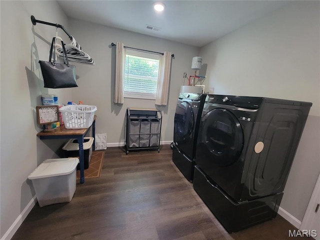 301 S Sloan St, Lebanon, MO 65536 - laundry area with washing machine and dryer, dark wood-type flooring, baseboards, and recessed lighting