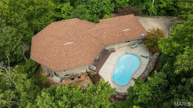 view of subject property featuring a pool area