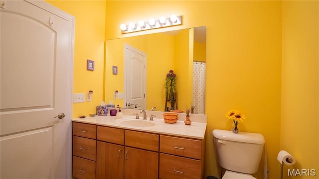 full bath with vanity and toilet