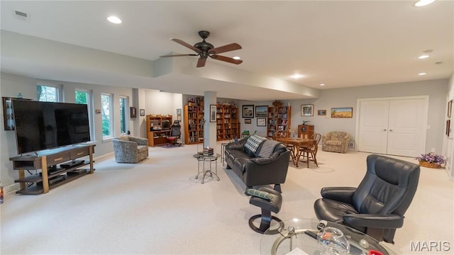 carpeted living area featuring recessed lighting, a ceiling fan, and baseboards