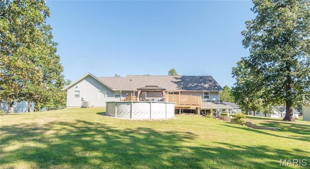 382 Christina Ln, Poplar Bluff, MO 63901 - rear view of house featuring a gazebo, an outdoor pool, and a yard