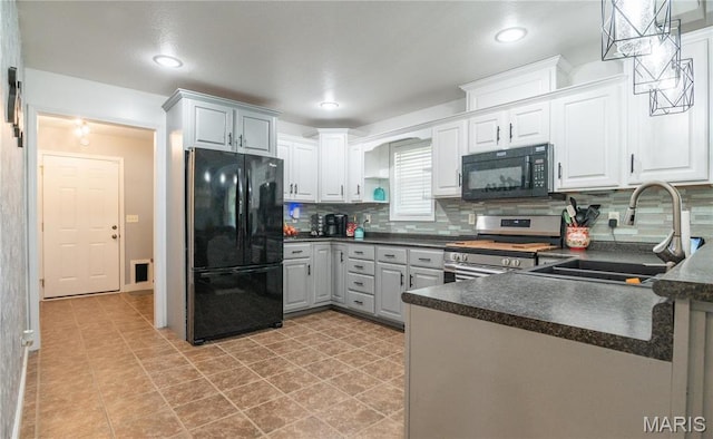 382 Christina Ln, Poplar Bluff, MO 63901 - kitchen with black appliances, dark countertops, backsplash, white cabinets, and recessed lighting