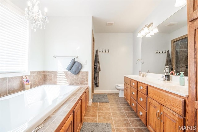 382 Christina Ln, Poplar Bluff, MO 63901 - full bath with double vanity, a bath, tile patterned floors, and a chandelier