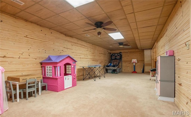 382 Christina Ln, Poplar Bluff, MO 63901 - recreation room featuring a ceiling fan, wooden walls, carpet flooring, and a drop ceiling