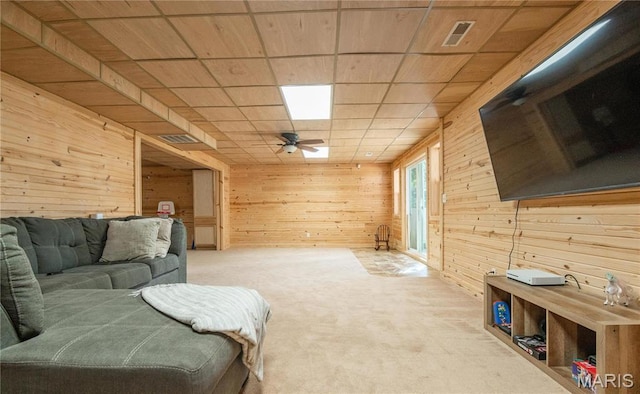 382 Christina Ln, Poplar Bluff, MO 63901 - carpeted living area with wooden walls and ceiling fan