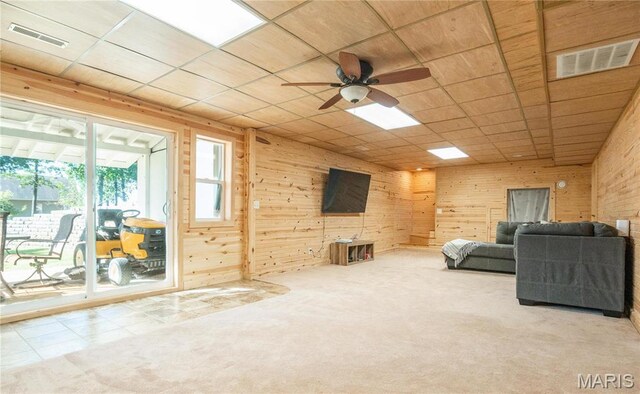 382 Christina Ln, Poplar Bluff, MO 63901 - carpeted living room with ceiling fan, wooden walls, and a paneled ceiling
