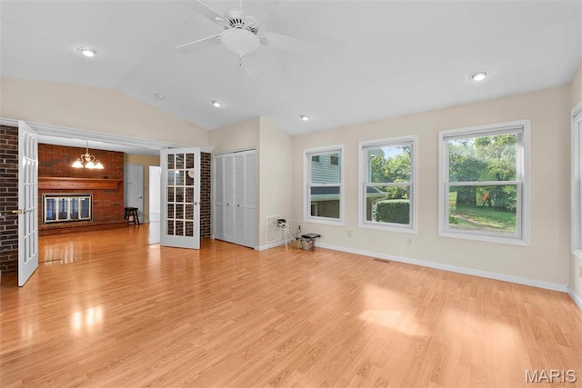 unfurnished living room featuring light wood-type flooring, baseboards, lofted ceiling, ceiling fan, and recessed lighting
