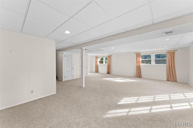 basement with carpet, healthy amount of natural light, recessed lighting, and a paneled ceiling