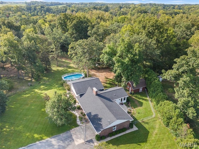 aerial overview of property's location featuring a forest