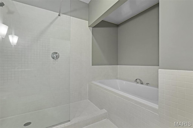 1010 Saint Charles St Unit 803, Saint Louis, MO 63101 - bathroom featuring tiled shower and a bath