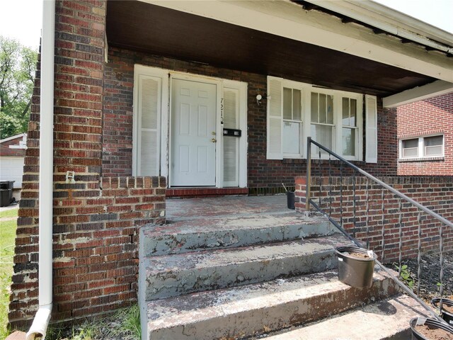 7210 Normandy Pl, Saint Louis, MO 63121 - entrance to property featuring covered porch and brick siding
