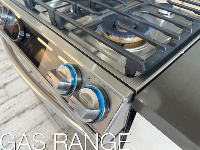 kitchen view of stainless steel range with gas stovetop