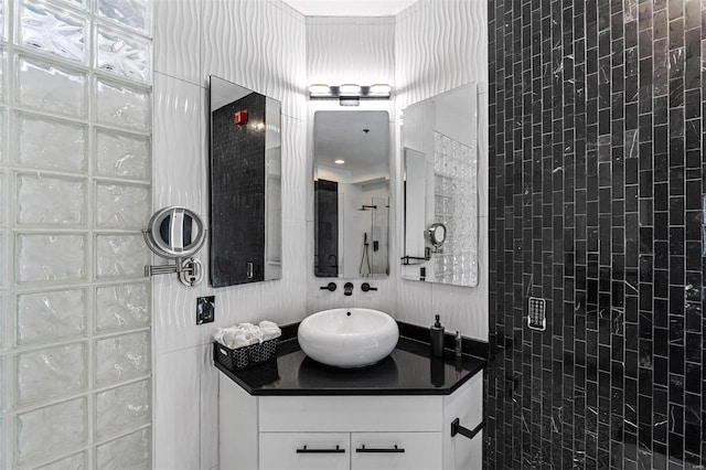 full bathroom featuring walk in shower and vanity