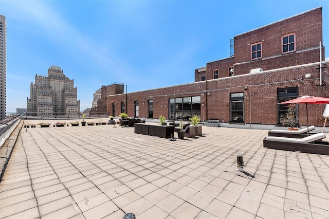 surrounding community with outdoor lounge area and a patio area