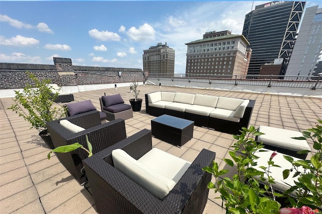 view of patio / terrace with an outdoor living space and a city view