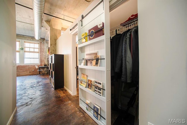 hall featuring concrete floors