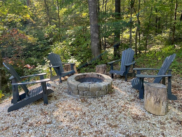 2359 Kitzbuhl Way S, Innsbrook, MO 63390 - view of patio with a fire pit and a forest view
