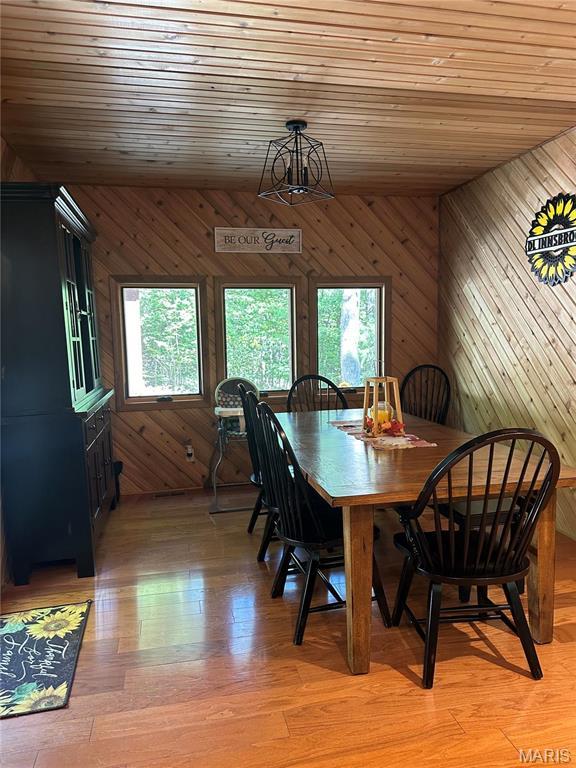 2359 Kitzbuhl Way S, Innsbrook, MO 63390 - dining area featuring plenty of natural light, wood walls, wooden ceiling, and light wood finished floors