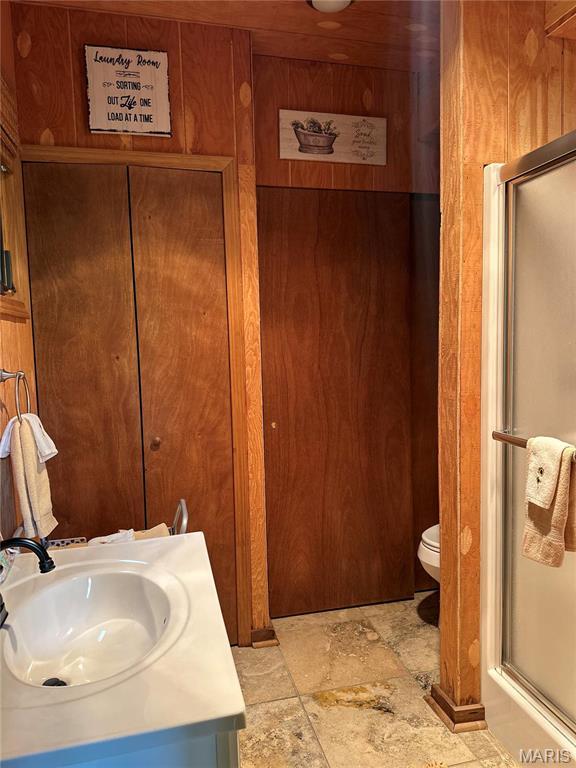 2359 Kitzbuhl Way S, Innsbrook, MO 63390 - full bathroom featuring vanity, toilet, a stall shower, and stone finish floors