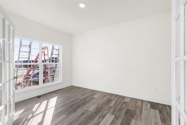 2438 Chukka Dr, Eureka, MO 63025 - unfurnished room featuring french doors, wood finished floors, baseboards, and recessed lighting