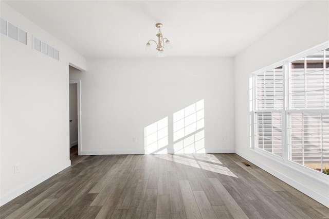 2438 Chukka Dr, Eureka, MO 63025 - unfurnished room with a chandelier, wood finished floors, and baseboards