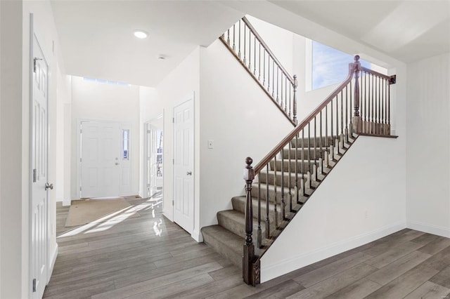 2438 Chukka Dr, Eureka, MO 63025 - staircase with wood finished floors, baseboards, and recessed lighting