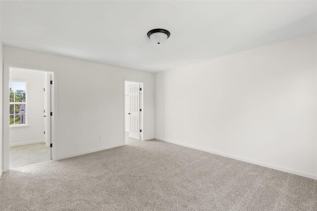 305 Winding Bluffs Ct, Fenton, MO 63026 - empty room featuring carpet flooring and baseboards