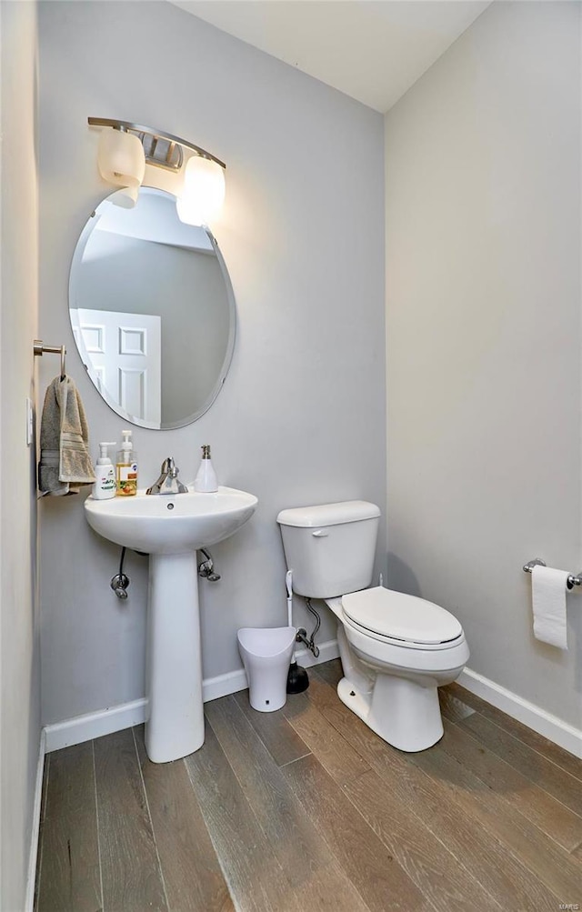120 Kelcross, Wentzville, MO 63385 - half bath with wood finished floors, toilet, baseboards, and a sink