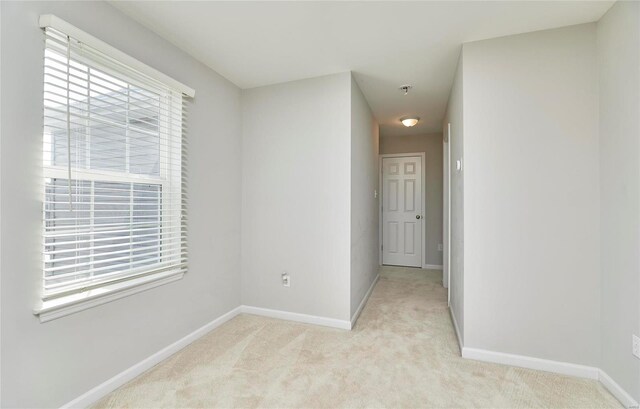 120 Kelcross, Wentzville, MO 63385 - empty room featuring baseboards, light colored carpet, and fire sprinkler in ceiling