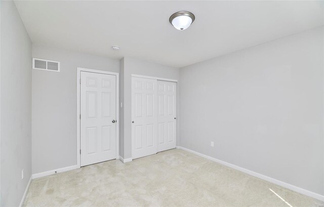 120 Kelcross, Wentzville, MO 63385 - unfurnished bedroom with light carpet, baseboards, and a closet
