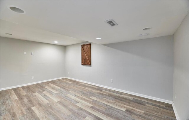 120 Kelcross, Wentzville, MO 63385 - finished below grade area featuring wood finished floors, baseboards, and recessed lighting