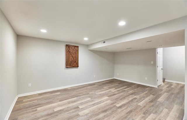 120 Kelcross, Wentzville, MO 63385 - finished below grade area with light wood finished floors, baseboards, and recessed lighting
