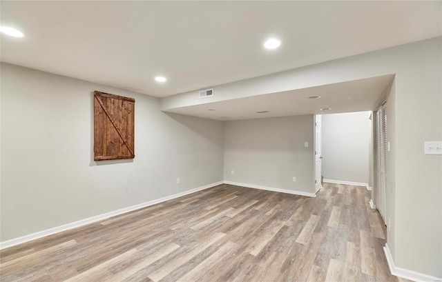 120 Kelcross, Wentzville, MO 63385 - finished below grade area with light wood-style flooring, recessed lighting, and baseboards