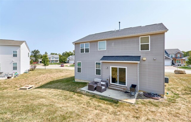 120 Kelcross, Wentzville, MO 63385 - rear view of house with a patio, a lawn, an outdoor hangout area, and a shingled roof