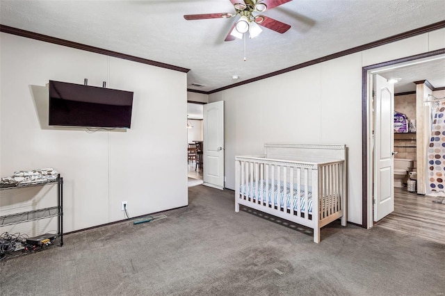 4002 County Road 20, Belleview, MO 63623 - bedroom with crown molding, a textured ceiling, carpet floors, a ceiling fan, and a crib