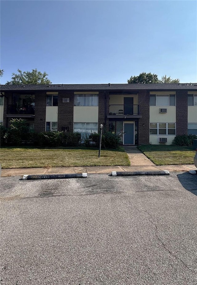 view of property with uncovered parking