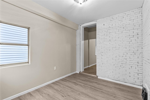 4634 Tyrolean Ave, Saint Louis, MO 63116 - unfurnished bedroom featuring light wood-type flooring and baseboards