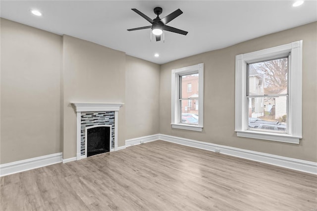 4634 Tyrolean Ave, Saint Louis, MO 63116 - unfurnished living room featuring wood finished floors, baseboards, and recessed lighting