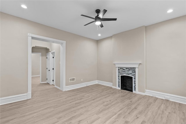 4634 Tyrolean Ave, Saint Louis, MO 63116 - unfurnished living room with wood finished floors, a ceiling fan, a fireplace, baseboards, and recessed lighting