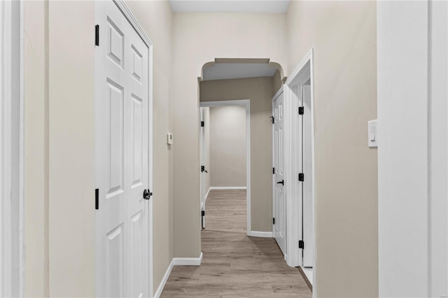 4634 Tyrolean Ave, Saint Louis, MO 63116 - hallway with baseboards and light wood-style floors