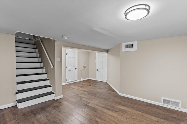 4634 Tyrolean Ave, Saint Louis, MO 63116 - finished below grade area with wood finished floors, baseboards, and stairs
