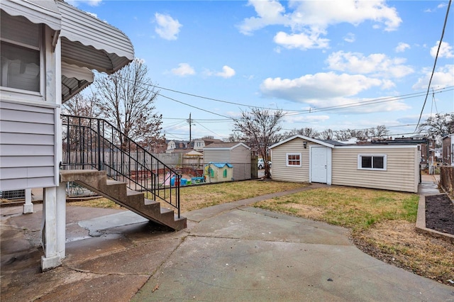 4634 Tyrolean Ave, Saint Louis, MO 63116 - view of yard with an outdoor structure, a patio, and stairway