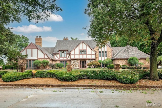 3112 Parkview Dr, Granite City, IL 62040 - tudor house featuring a chimney and stone siding