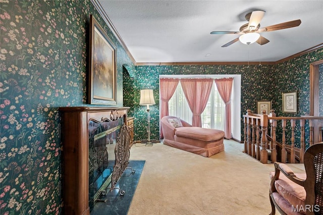 3112 Parkview Dr, Granite City, IL 62040 - sitting room featuring crown molding, carpet flooring, wallpapered walls, a ceiling fan, and an upstairs landing