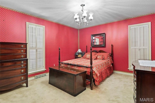 3112 Parkview Dr, Granite City, IL 62040 - bedroom with wallpapered walls, carpet, and a chandelier
