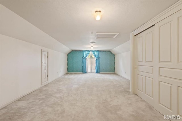 3112 Parkview Dr, Granite City, IL 62040 - additional living space with light colored carpet, vaulted ceiling, and attic access