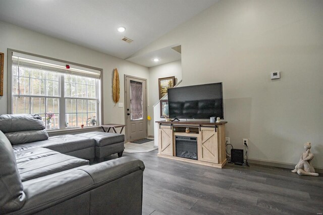 114 Mayson Ln, Poplar Bluff, MO 63901 - living room featuring vaulted ceiling, wood finished floors, a glass covered fireplace, recessed lighting, and baseboards