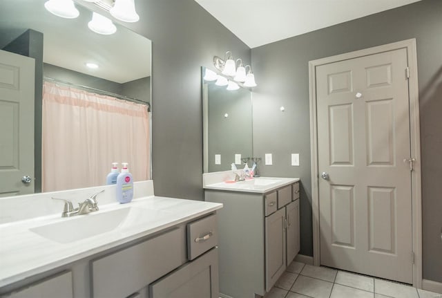 114 Mayson Ln, Poplar Bluff, MO 63901 - full bath with tile patterned floors, two vanities, and baseboards